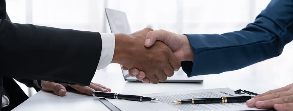 Agent shaking hands with client